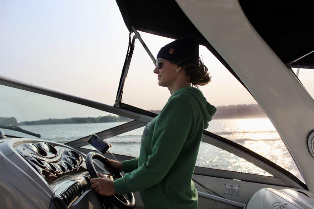 woman piloting boat